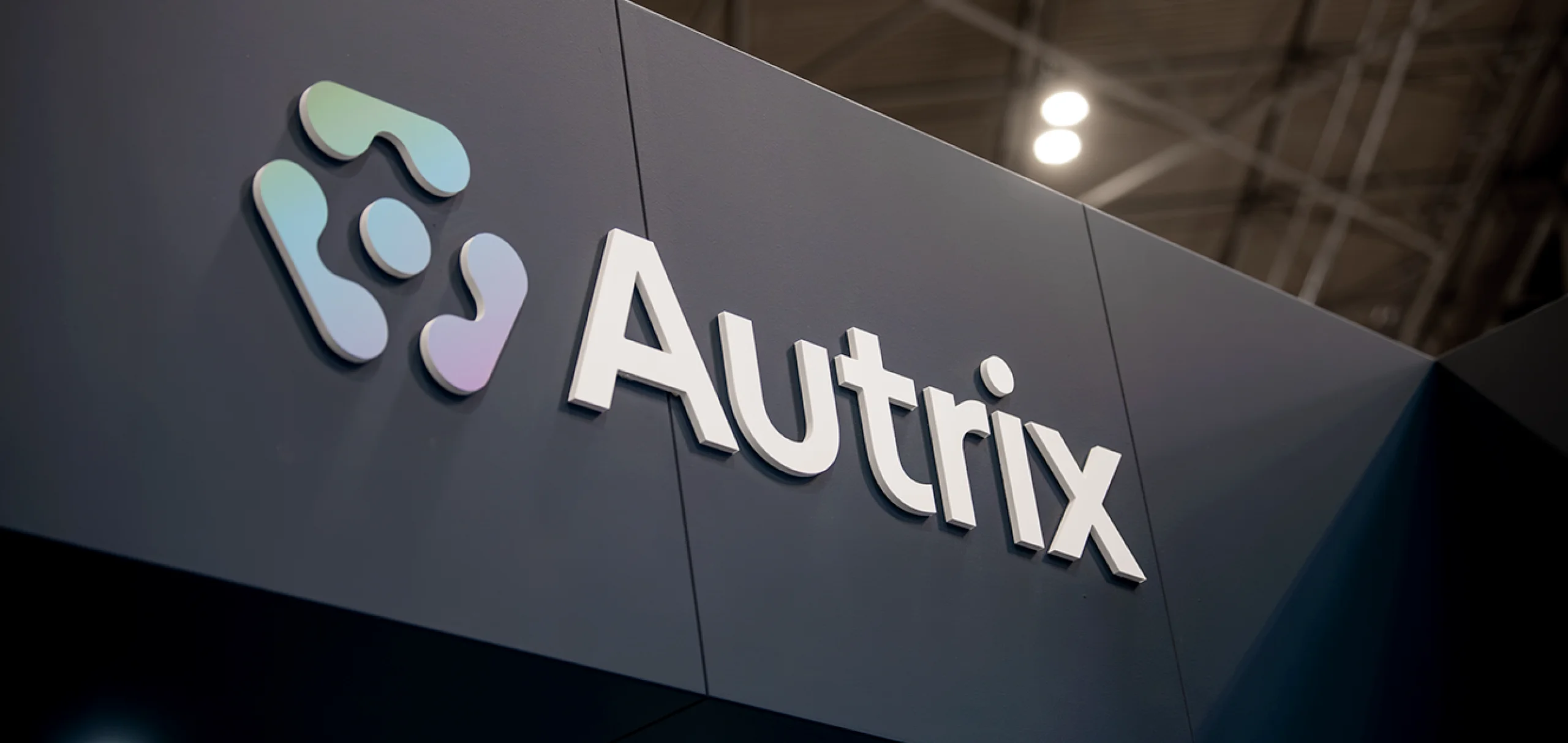 An acrylic cutout of the Autrix logo.