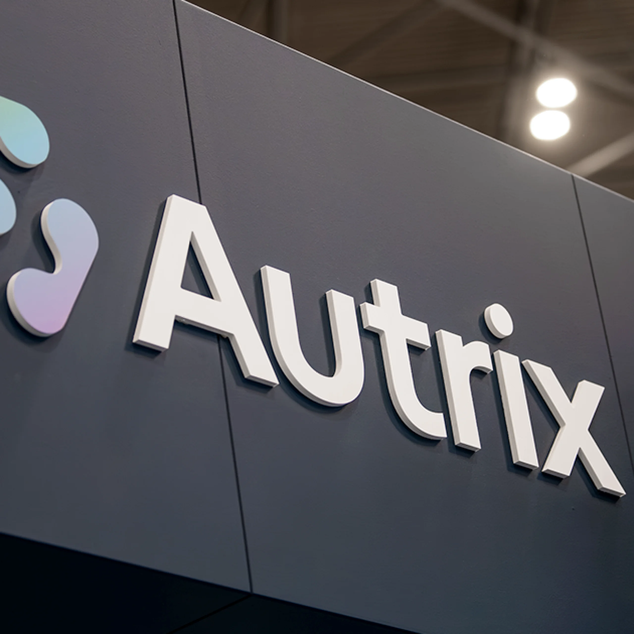 An acrylic cutout of the Autrix logo.