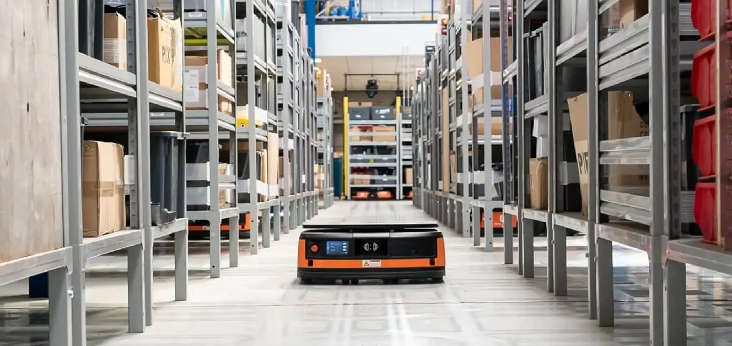 One of Autrix's robots in a warehouse aisle.