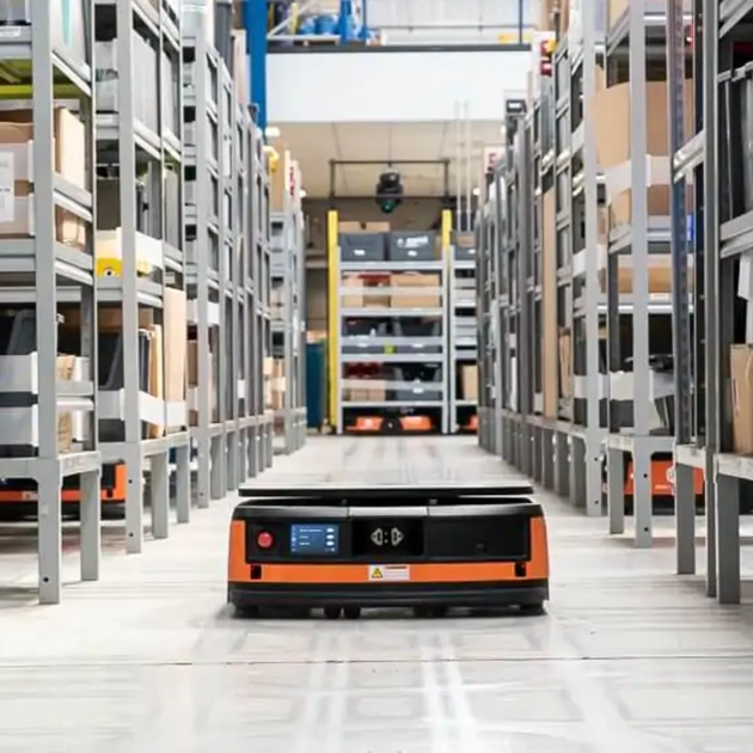 One of Autrix's robots in a warehouse aisle.